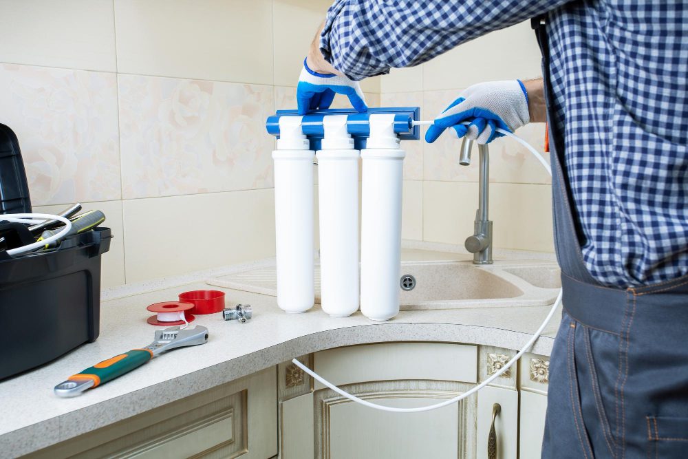 technician installing water filter